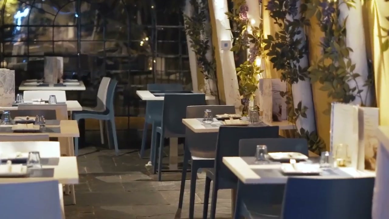 The softly lit dining room at OPA Bath